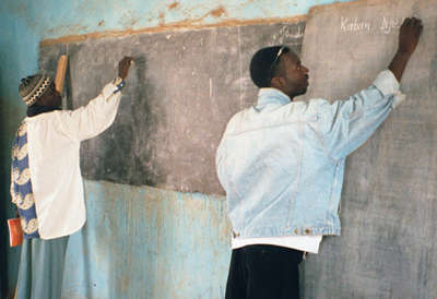 Teachers at Chalkboard